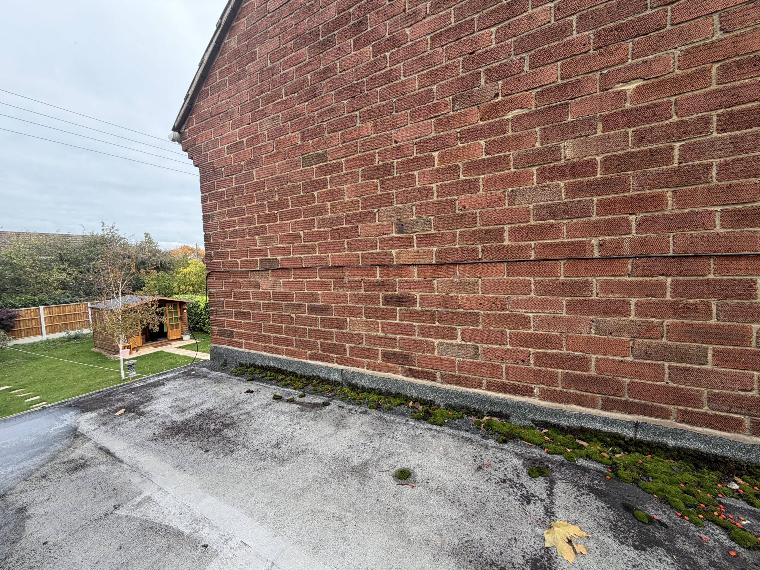 Outdoor Cat6 cable secured along the house wall