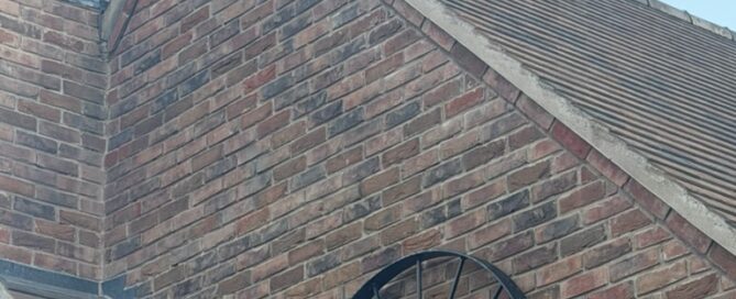 Starlink dish neatly mounted beside the chimney at a home in Lower Moor, Worcestershire
