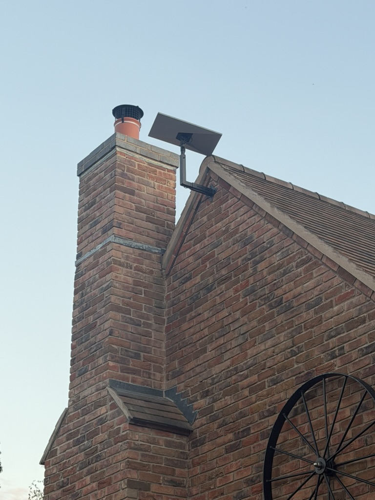Starlink installation in Lower Moor – roof detail Starlink dish and mounting bracket with a tidy cable route at the Lower Moor property