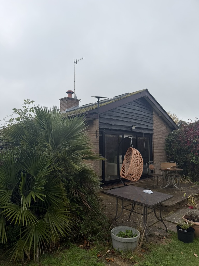Discreet Starlink dish installation viewed from the garden at the Wichenford home